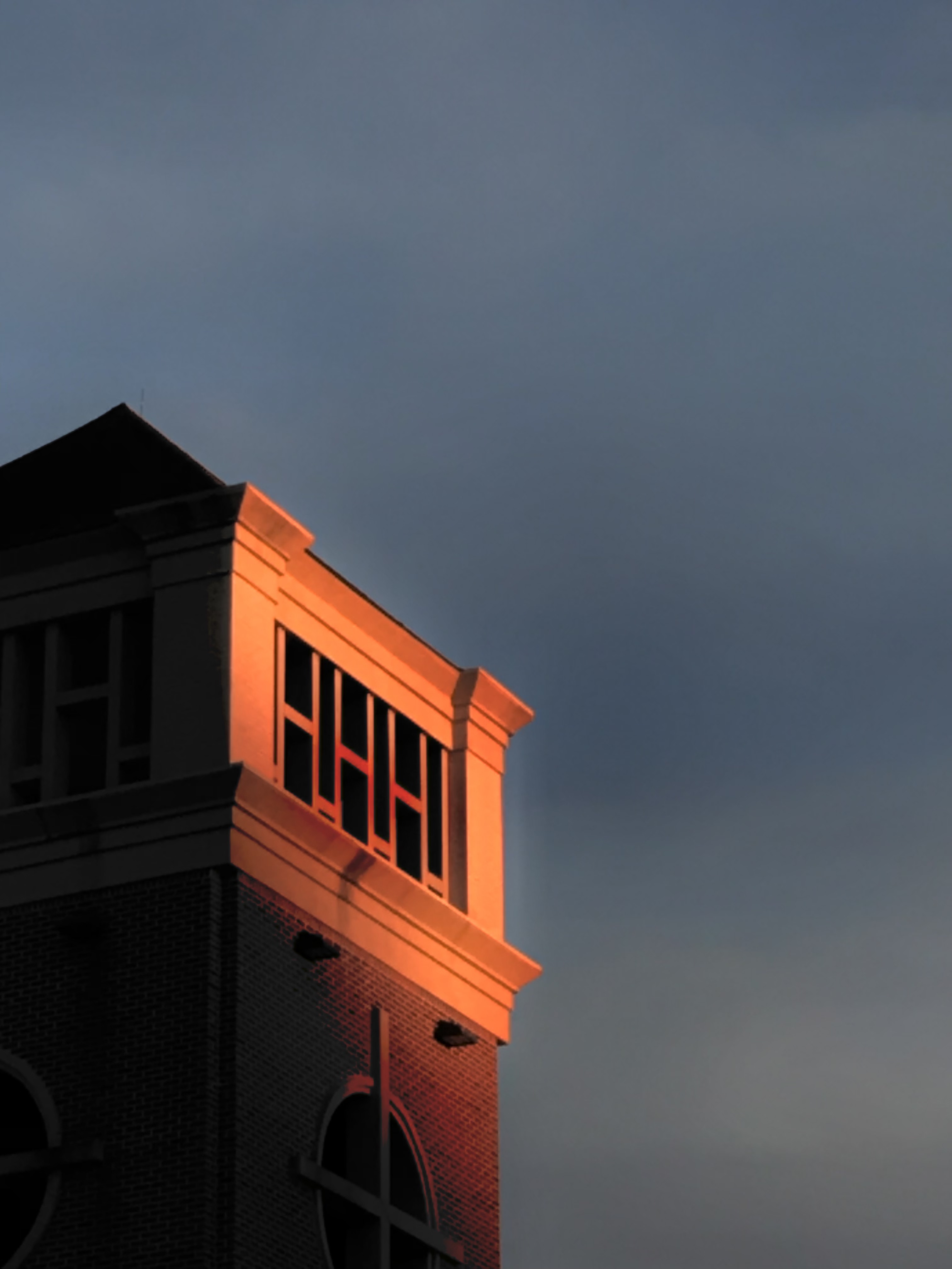 image of a bell tower in the sunset.